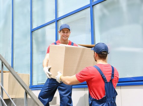 Local Blackwall home removals team handling furniture and packing for storage